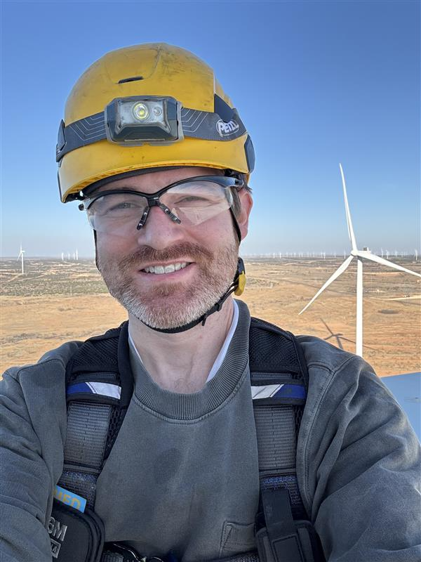 Danny Sale on top of a wind turbine